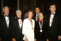 <p>From left: Joe DiMaggio, Victor Borge, Anita Bryant, Muhammad Ali, Rosa Parks and Donald Trump pose for a photograph after receiving the Ellis Island Medal of Honor on Oct. 27, 1986, in New York City. <i>(Photo: Yvonne Hemsey/Getty Images)</i> </p>