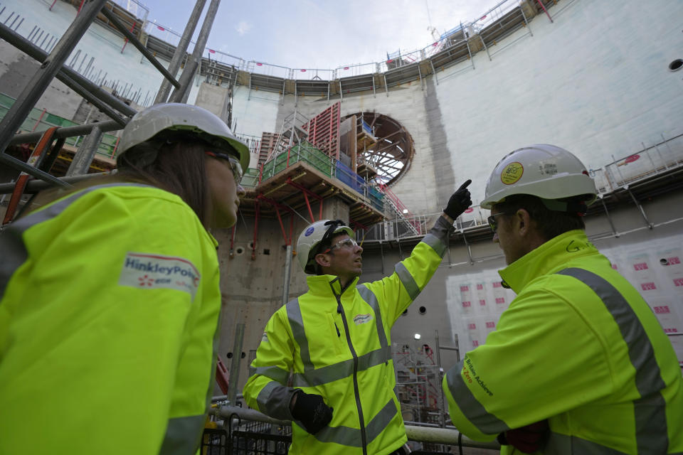 Workers work at the construction site of Hinkley Point C nuclear power station in Somerset, England, Tuesday, Oct. 11, 2022. Sites like the Hinkley Point C nuclear power plant have become integral to the U.K. government’s “net zero” by 2050 strategy. (AP Photo/Kin Cheung)