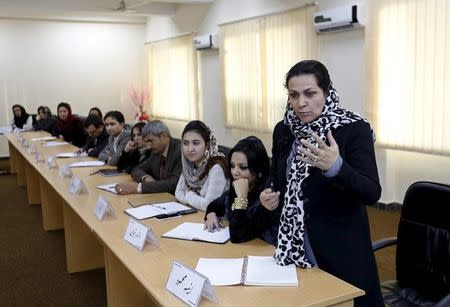 An Afghan woman speaks as they attend a class of the gender and women's studies masters program in Kabul University, Afghanistan October 19, 2015. REUTERS/Mohammad Ismail