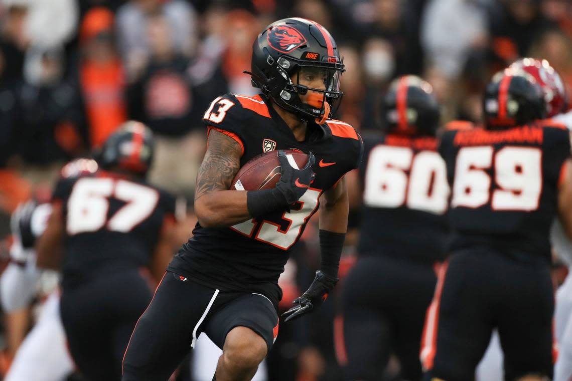 Oregon State wide receiver Jesiah Irish (13) rushes against Utah during the first half of an NCAA college football game Saturday, Oct. 23, 2021, in Corvallis, Ore. Oregon State won 42-34. (AP Photo/Amanda Loman)