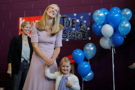 U.S. Rep. Kennedy III’s wife Lauren and their daughter Eleanor listen as he announces his candidacy for the U.S. Senate in Boston