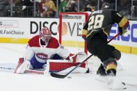 Montreal Canadiens goaltender Carey Price (31) blocks a shot by Vegas Golden Knights left wing William Carrier (28) during the second period in Game 1 of an NHL hockey Stanley Cup semifinal playoff series Monday, June 14, 2021, in Las Vegas. (AP Photo/John Locher)