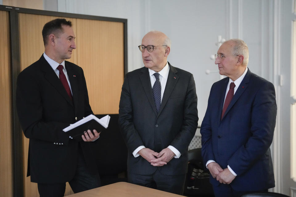 Members of the Liberation Mission, the specially-created body that is organizing the 80th anniversary commemorations, chairman Philippe Etienne, center, director-general Michel Delion, left, and Fabien Sudry, deputy director-general, speak together, in Paris, Wednesday, Jan. 17, 2024. France is getting ready to show its gratitude towards World War II veterans who will come, many for the last time, on Normandy beaches for D-Day ceremonies that will come as part of a series of major commemorations this year and next marking eight decades since the defeat of the Nazis. (AP Photo/Thibault Camus)