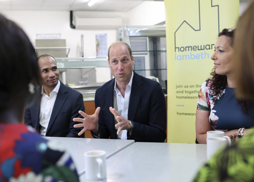 Britain's Prince William speaks with members during a visit to Mosaic Clubhouse in Lambeth, which supports people living with mental health conditions across Lambeth, as part of his tour of the UK to launch a project aimed at ending homelessness, in London, Monday, June 26, 2023. (Chris Jackson/PA via AP)