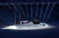 Performers raise the Russian national flag during the opening ceremony of the 2014 Sochi Winter Olympics, February 7, 2014. REUTERS/Mark Blinch