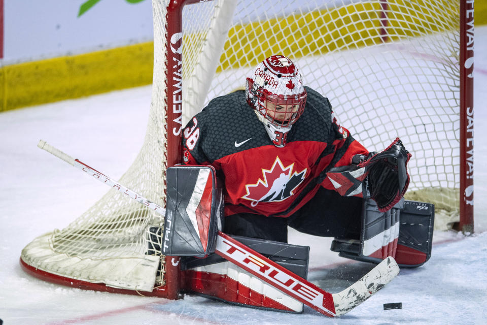 Canada goaltender Emerance Maschmeyer (38) stops a U.S. shot during the third period of a Rivalry Series hockey game Friday, Feb. 9, 2024, in Regina, Saskatchewan. (Liam Richards/The Canadian Press via AP)