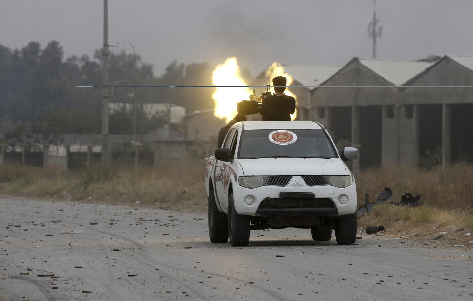 Fighters loyal to the Libyan internationally-recognised Government of National Accord (GNA) fire a heavy machine gun during clashes against forces loyal to strongman Khalifa Haftar, on May 21, 2019 in the Salah al-Din area south of the Libyan capital Tripoli. (Photo: Mahmud Turkia/AFP/Getty Images)