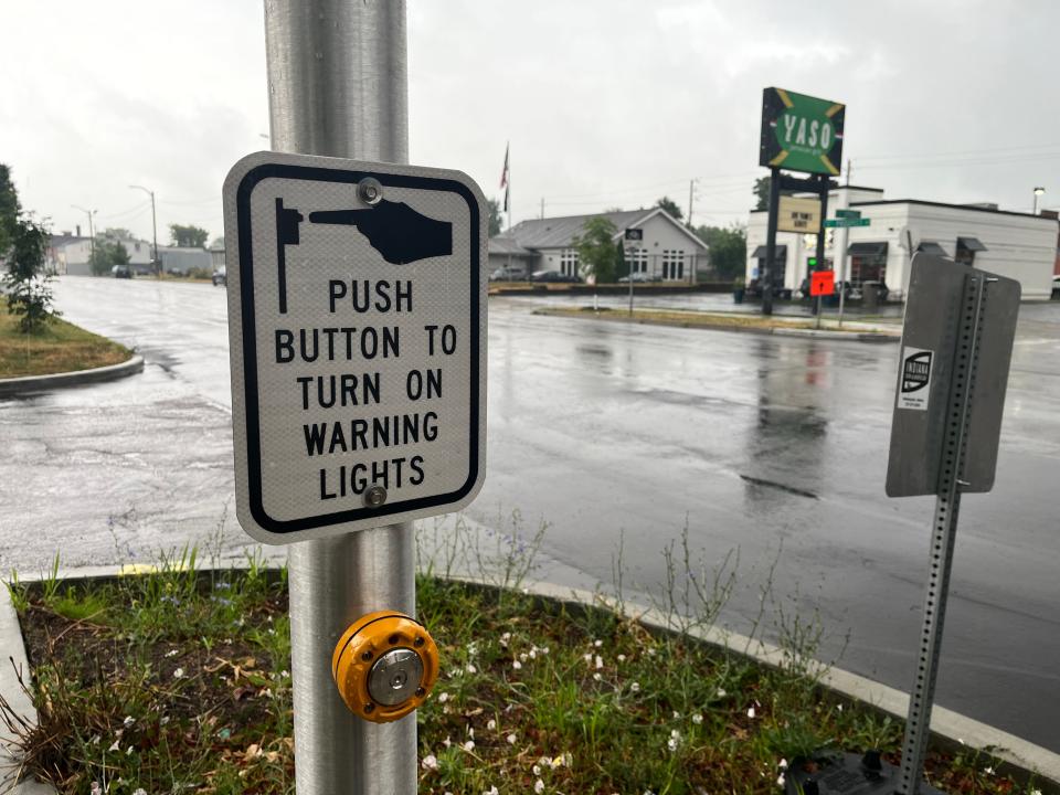 New sidewalk concrete, ADA-compliant curbs and Rectangular Rapid-Flashing Beacons have been installed at the intersection of Prospect and Spruce Streets on Indianapolis' southeast side as part of a $4.5 million Safe Routes to Transit program.