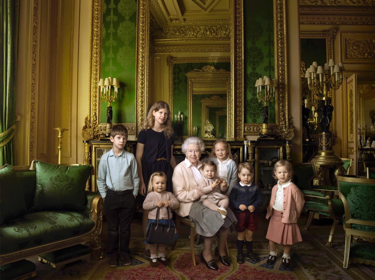 Annie Liebovitz photographed Queen Elizabeth II with her two grandchildren, James, Viscount Severn (L) and Lady Louise (2L) and her five great-grandchildren Mia Tindall, Savannah Philipps (3R), Isla Phillips (R), Prince George (2R) and Princess Charlotte (C) in the Green Drawing room at Windsor Castle in Windsor.