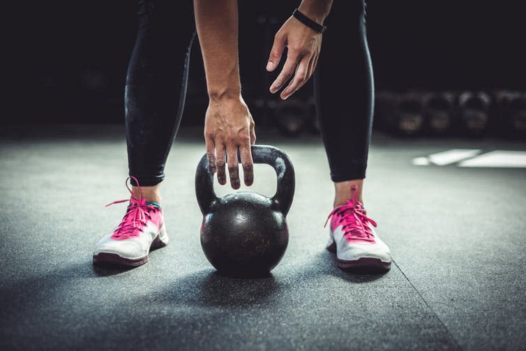 <span class="caption">Take up kettlebells in your 40s to burn calories.</span> <span class="attribution"><a class="link " href="https://www.shutterstock.com/download/confirm/710451286?src=9GFbh6gdP9DDGK6CptidiQ-1-4&size=medium_jpg" rel="nofollow noopener" target="_blank" data-ylk="slk:Goolia Photography/Shutterstock;elm:context_link;itc:0;sec:content-canvas">Goolia Photography/Shutterstock</a></span>