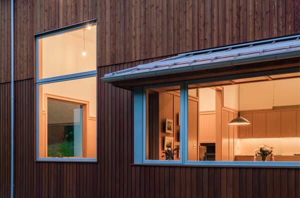 The home’s public volume has a barn-like form and wood-clad exterior, while the corrugated private volumes provide a contemporary counterpoint. 