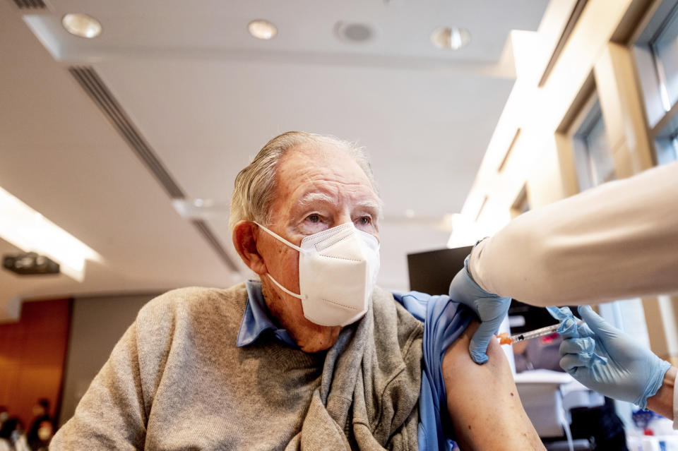 FILE - In this Jan. 12, 2021, file photo, Ken Towns receives a first dose of Pfizer-BioNTech COVID-19 vaccine from UC Davis Health in Sacramento, Calif. Uncertainty over the pace of federal COVID-19 vaccine allotments triggered anger and confusion Friday, Jan. 15, 2021, in some states where officials worried that expected shipments would not be forthcoming. (AP Photo/Noah Berger, Pool, File)