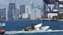 <p>The boat in which Miami Marlins pitcher Jose Fernandez was killed is towed through government cut, Sunday, Sept. 25, 2016, in Miami Beach. (Joe Caveretta/Sun Sentinel/TNS via Getty Images) </p>