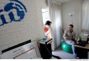 Start-up office, with one guy sticking his head in the door