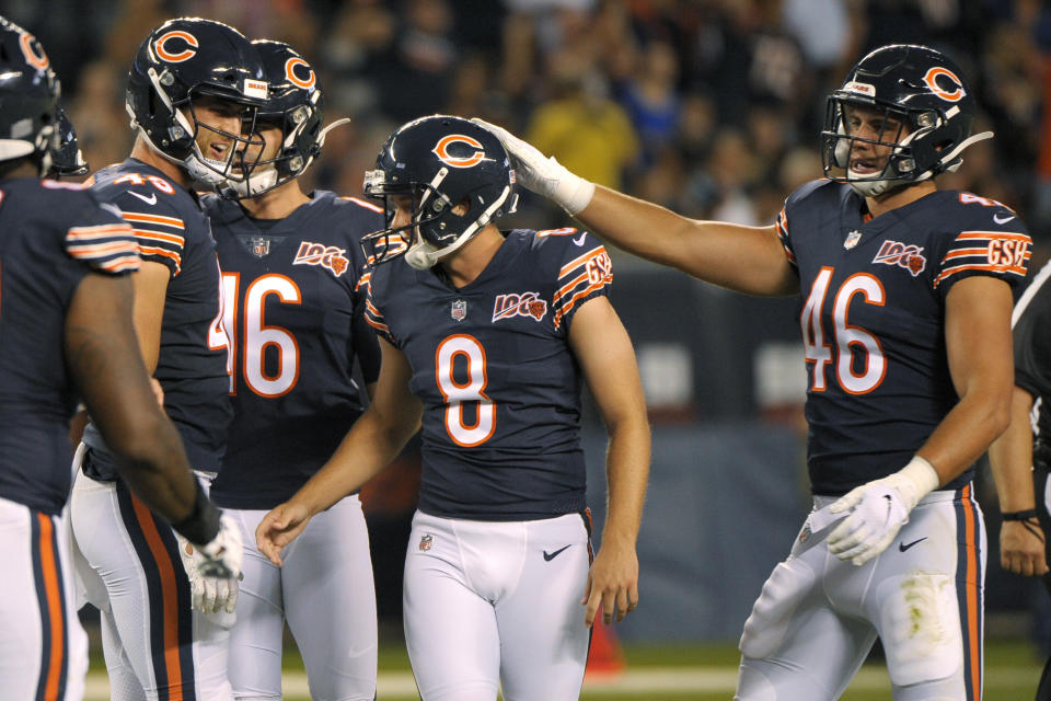 The Chicago Bears congratulate kicker Elliott Fry (8) after he made a field goal during the first half of the team's NFL preseason football game against the Carolina Panthers on Thursday, Aug. 8, 2019, in Chicago. (AP Photo/Mark Black )