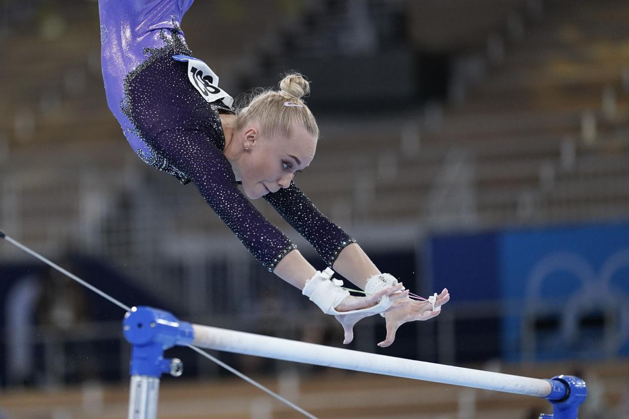 Angelina Melnikova of the Russian Olympic Committee performs on the uneven bars during the artistic gymnastics women's apparatus final at the 2020 Summer Olympics, Sunday, Aug. 1, 2021, in Tokyo, Japan.