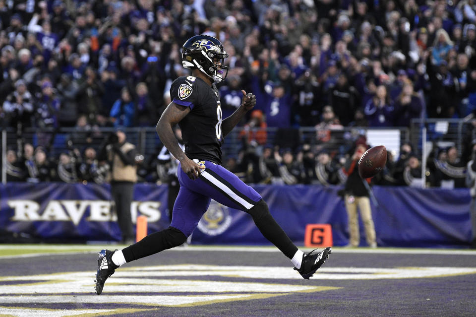 Baltimore Ravens quarterback Lamar Jackson scores a touchdown in the first half of an NFL football game against the Cleveland Browns, Sunday, Dec. 30, 2018, in Baltimore. (AP Photo/Nick Wass)