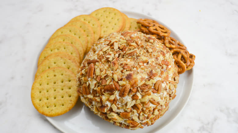 cheese ball on plate with crackers