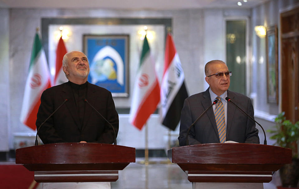 Iraqi Foreign Minister Mohamed Alhakim, right, holds a press conference with his visiting Iranian counterpart Mohammad Javad Zarif, at the Ministry of Foreign Affairs in Baghdad, Iraq, Sunday, May 26, 2019. (AP Photo/Khalid Mohammed)