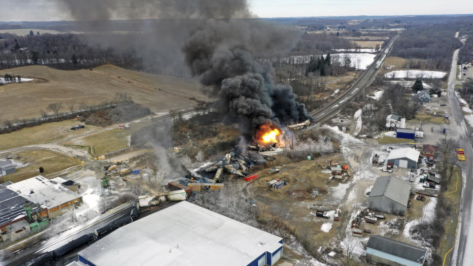 FILE - A plume of smoke rises from a Norfolk Southern train that derailed Friday night in East Palestine, Ohio are still on fire at mid-day, Feb. 4, 2023. After toxic chemicals were released into the air from a wrecked train in Ohio, evacuated residents remain in the dark about what toxic substances are lingering in their vacated neighborhoods while they await approval to return home. (AP Photo/Gene J. Puskar, File)