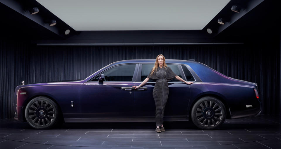 Fashion designer Iris van Herpen stands next to the Phantom Syntopia, her collaboration with Rolls-Royce.