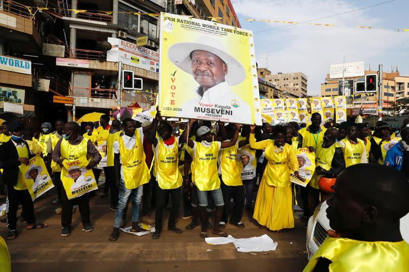 Polling agents from the National Resistance Movement (NRM) party celebrate the victory of Uganda's President Yoweri Museveni in the concluded general elections in Kampala