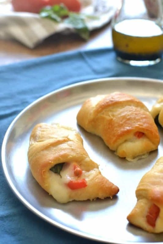 <p>Lemon Tree Dwelling</p><p>These Caprese Crescent Rolls come together in a snap and make a delicious summer appetizer that's packed with flavor!</p><p><strong>Get the recipe: <a href="https://www.lemontreedwelling.com/caprese-crescent-rolls/" rel="nofollow noopener" target="_blank" data-ylk="slk:Caprese Crescent Rolls;elm:context_link;itc:0;sec:content-canvas" class="link ">Caprese Crescent Rolls</a></strong></p>