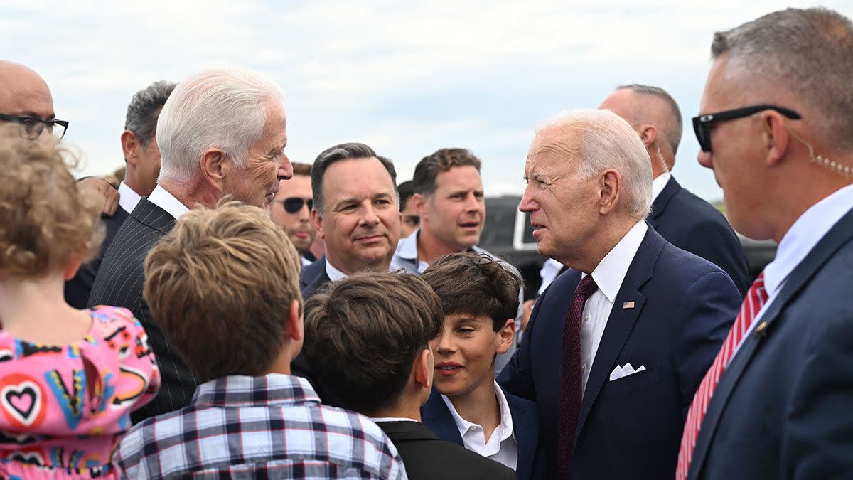 A video claimed to show US President Joe Biden nibble a young child or girl at an airport. 