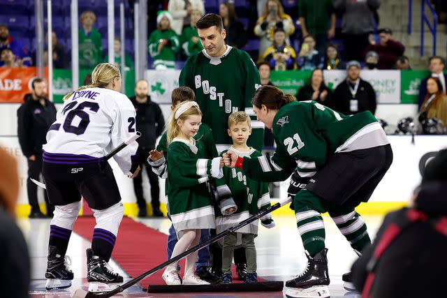 <p>Danielle Parhizkaran/The Boston Globe via Getty </p> Hilary Knight Shares Fist Bump With Patrice Burgeron's Daughter Victoria