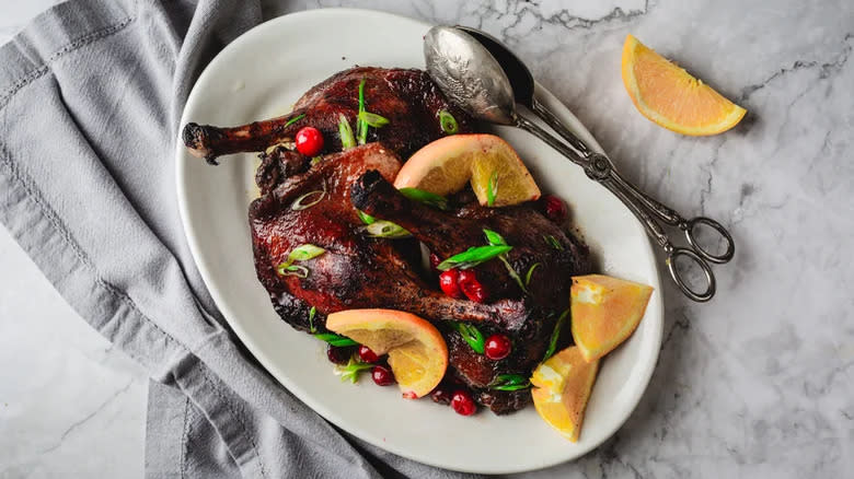 Duck legs with orange and cranberries