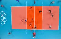 <p>Russia's Igor Kobzar (centre L) prepares to return the ball in the men's quarter-final volleyball match between Canada and Russia during the Tokyo 2020 Olympic Games at Ariake Arena in Tokyo on August 3, 2021. (Photo by Antonin THUILLIER / AFP)</p> 