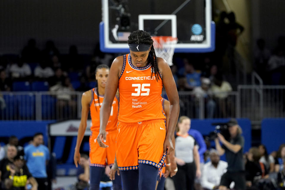 Connecticut Sun's Jonquel Jones walks with her head down near the end of the first half of Game 2 in the team's WNBA basketball playoffs semifinal against the Chicago Sky on Wednesday, Aug. 31, 2022, in Chicago. (AP Photo/Nam Y. Huh)