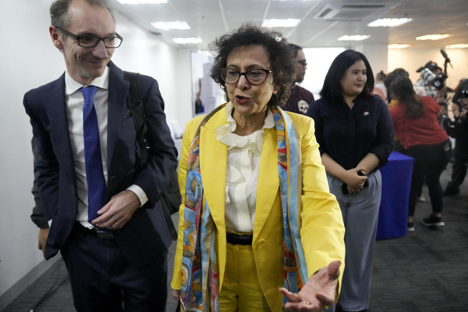 United Nations Special Rapporteur on Freedom of Opinion and Expression Irene Khan, center, gestures after talking to reporters during a press conference in Mandaluyong, Philippines on Friday Feb. 2, 2024. A United Nations expert said Friday that steps have been taken under Philippine President Ferdinand Marcos Jr. to deal with human rights atrocities, like the killings of journalists and rights defenders, but added that much more need to be done like ensuring accountability. (AP Photo/Aaron Favila)