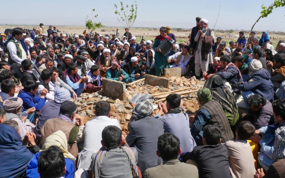Afghans mourn at a burial ceremony of the slain Shiite Muslims after gunmen attacked a  mosque in Guzara district of Herat province (AFP via Getty Images)