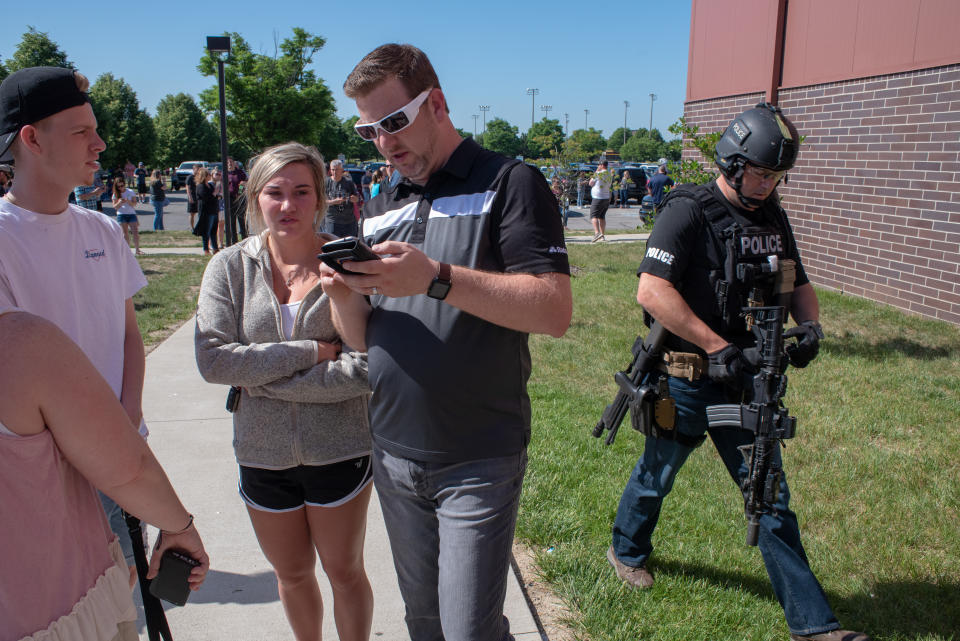 <p>Parents wait while a SWAT officer passes outside Noblesville High School after a shooting at Noblesville West Middle School on May 25, 2018 in Noblesville, Ind. (Photo: Kevin Moloney/Getty Images) </p>