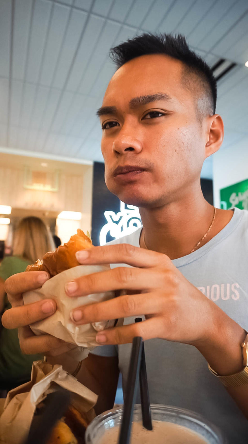 author tasting the crispy chick'n sandwich and looking confused