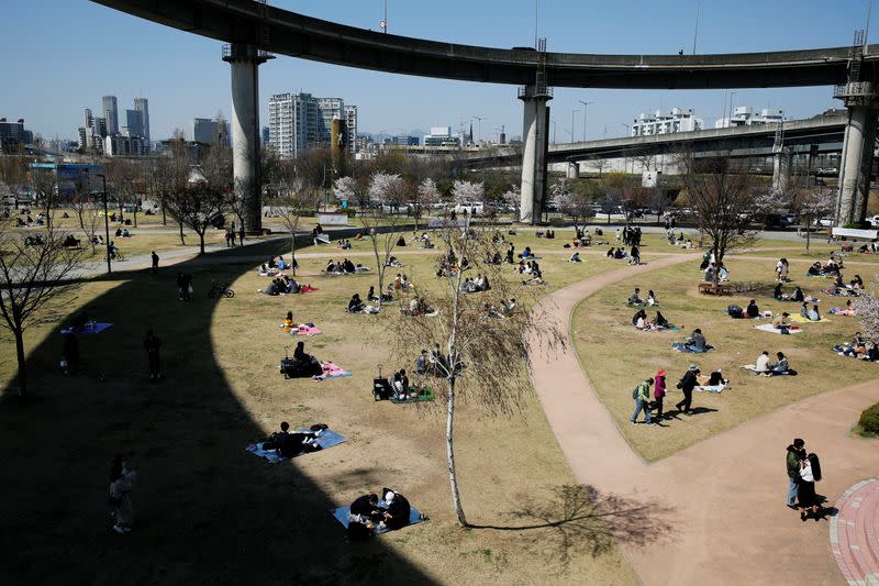 People enjoy a picnic at a Han River Park following the outbreak of the coronavirus disease (COVID-19), in Seoul