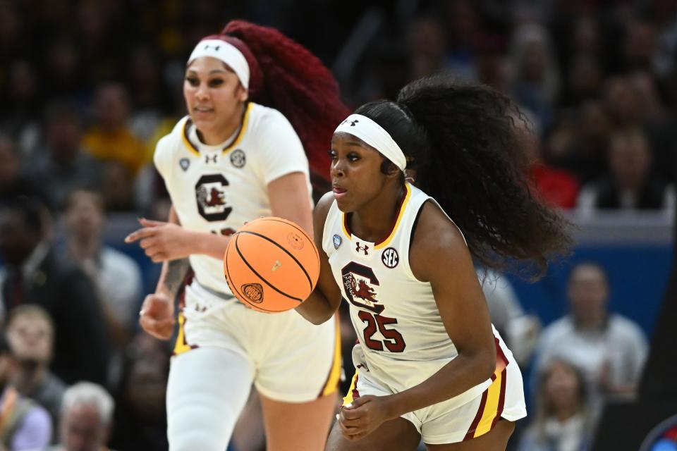 South Carolina Gamecocks guard Raven Johnson (25) dribbles the ball as center Kamilla Cardoso trails against the Iowa Hawkeyes during the 2024 NCAA Tournament championship game.