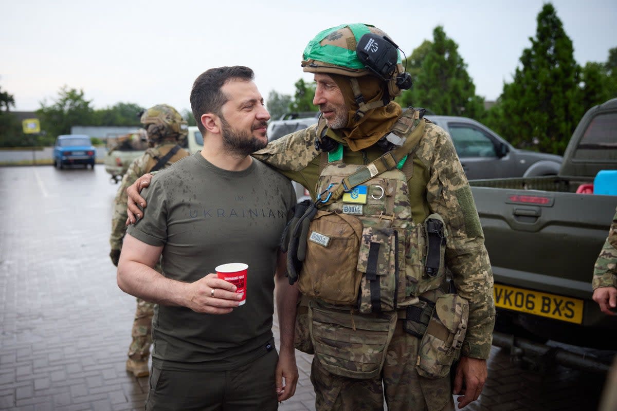 Zelensky poses with a serviceman at a gas station during a visit to the Donetsk region on 26 June 2023 (Handout/Ukrainian Presidential Press Service/AFP via Getty Images)