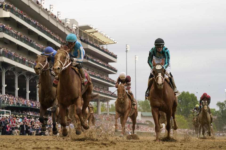 Mage, second from left, with Javier Castellano aboard, wins the 149th running of the Kentucky Derby horse race at Churchill Downs Saturday, May 6, 2023, in Louisville, Ky. (AP Photo/Jeff Roberson)