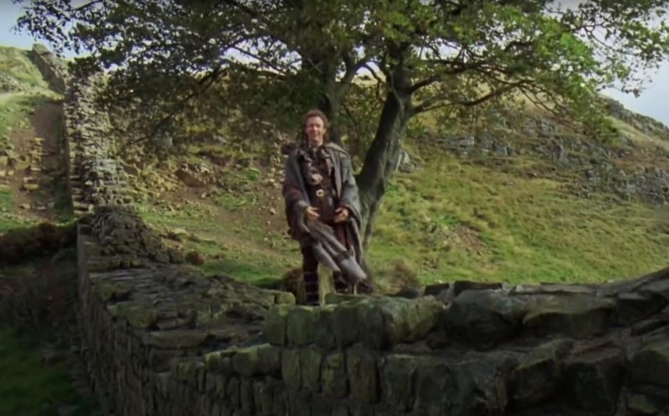 Kevin Costner's Robin Hood next to the famous tree in the 1991 film (handout)