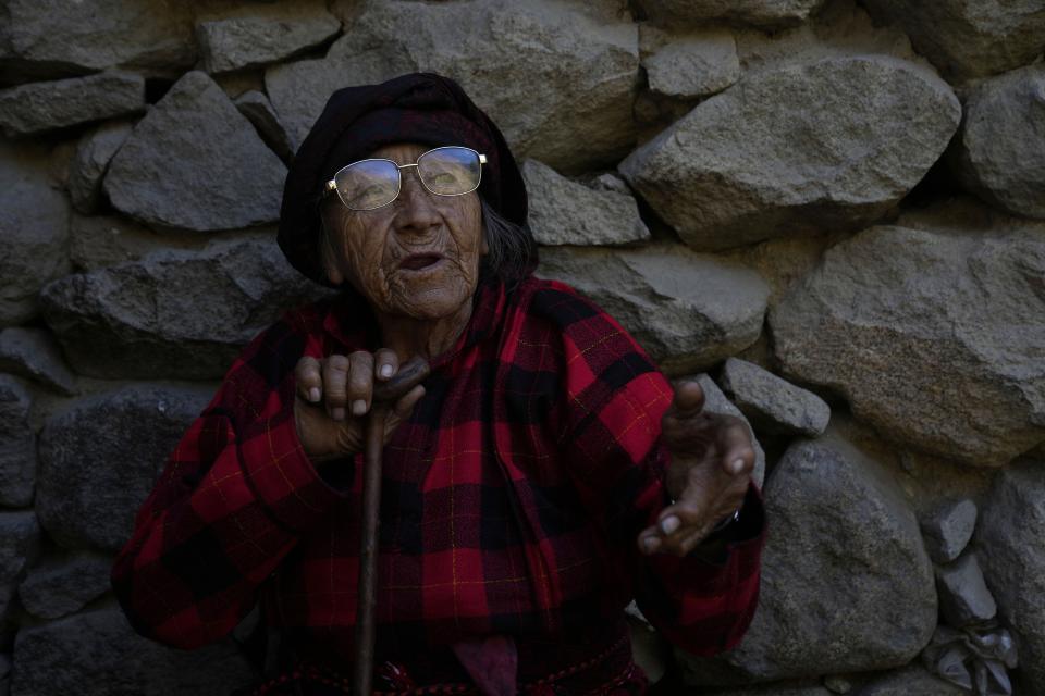 Rosalbina Valerio, an 83-year-old who tells stories to school children and teaches them the Jaqaru Indigenous language, gives an interview in Tupe, Peru, Tuesday, July 19, 2022. As Peru´s President Pedro Castillo marks the first anniversary of his presidency, his popularity has been decimated by his chaotic management style and corruption allegations, but in rural areas like Tupe, voters believe the fault for the executive crisis lies not only with Castillo, but with Congress, which has sought to remove him twice. (AP Photo/Martin Mejia)