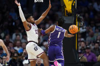 TCU guard Mike Miles Jr., right, drives as Gonzaga guard Malachi Smith defends during the first half of a second-round college basketball game in the men's NCAA Tournament Sunday, March 19, 2023, in Denver. (AP Photo/John Leyba)