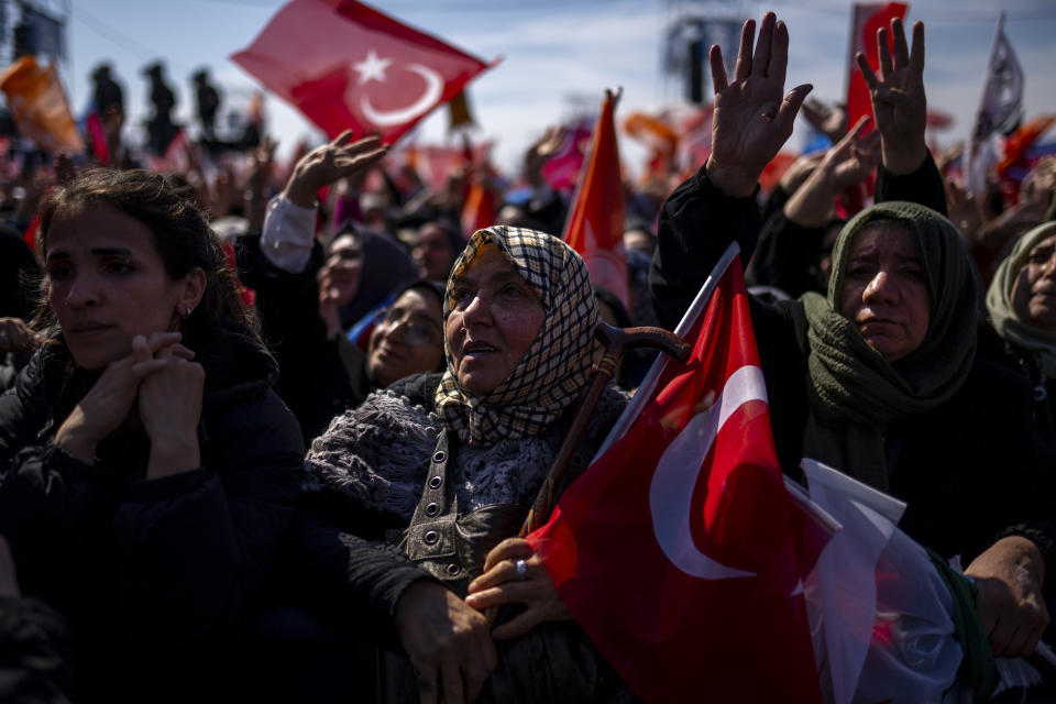 Supporters listen to Turkish President and leader of the Justice and Development Party, or AKP, Recep Tayyip during a campaign rally in Istanbul, Turkey, Sunday, March 24, 2024. Turkey was coming to terms on Monday with the opposition's unexpected success in local elections which saw it outperform President Recep Tayyip Erdogan's ruling party and add to municipalities gained five years ago. (AP Photo/Francisco Seco)