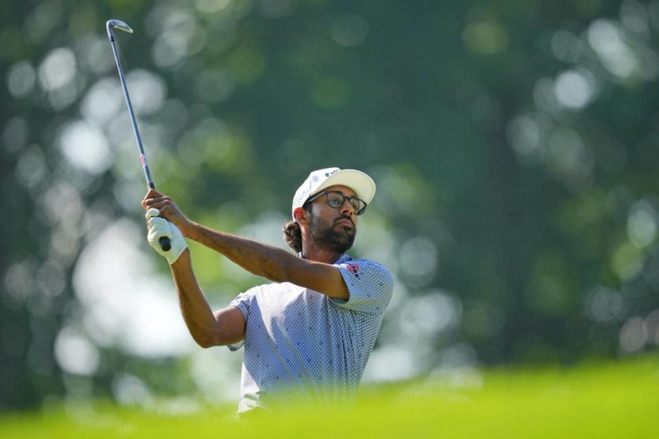 Akshay Bhatia takes a shot on the 12th fairway during the first round of the PGA Championship golf tournament at Valhalla Golf Club.