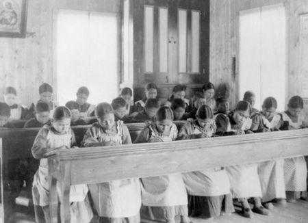 Students sit in a classroom at St Joseph's Convent, otherwise known as the Fort Resolution Indian Residential School in Fort Resolution, Northwest Territories in an undated archive photo. REUTERS/Library and Archives Canada/PA-042133/handout via Reuters