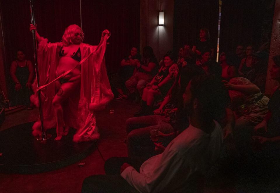 A burlesque dancer performs.