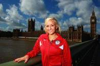 LONDON, ENGLAND - SEPTEMBER 13: Gymnast Nastia Liukin of the USA poses in front of Big Ben and the Houses of Parliament during a tour of London on September 13, 2011 in London, England. (Photo by Bryn Lennon/Getty Images for USOC)