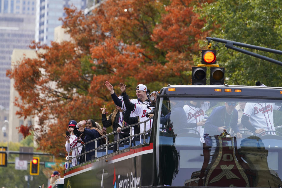 Atlanta Braves players celebrate the team's victory during a victory parade, Friday, Nov. 5, 2021, in Atlanta. The Braves beat the Houston Astros 7-0 in Game 6 on Tuesday to win their first World Series baseball title in 26 years. (AP Photo/Brynn Anderson)
