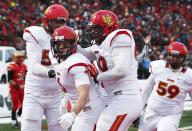 Calgary Dinos Jake Harty (6) celebrates his touchdown on the Laval Rouge et Or with teammates Braden Schram (L), Sean McEwen and Ryan Preuter (59) during the Vanier Cup University Championship football game in Quebec City, Quebec, November 23, 2013. REUTERS/Mathieu Belanger (CANADA - Tags: SPORT FOOTBALL)